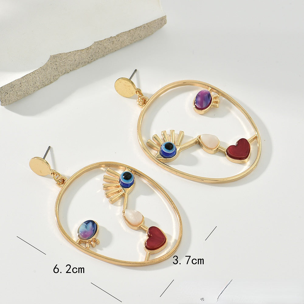 Wholesale Devil Eye Heart Face Alloy Earrings